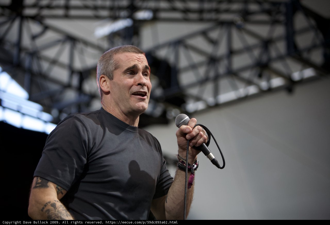 Henry Rollins Takes the Stage with Mic in Hand