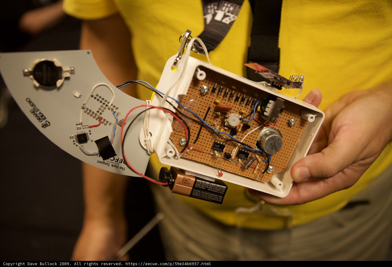 Tech-Savvy Man with a Circuit Board Device