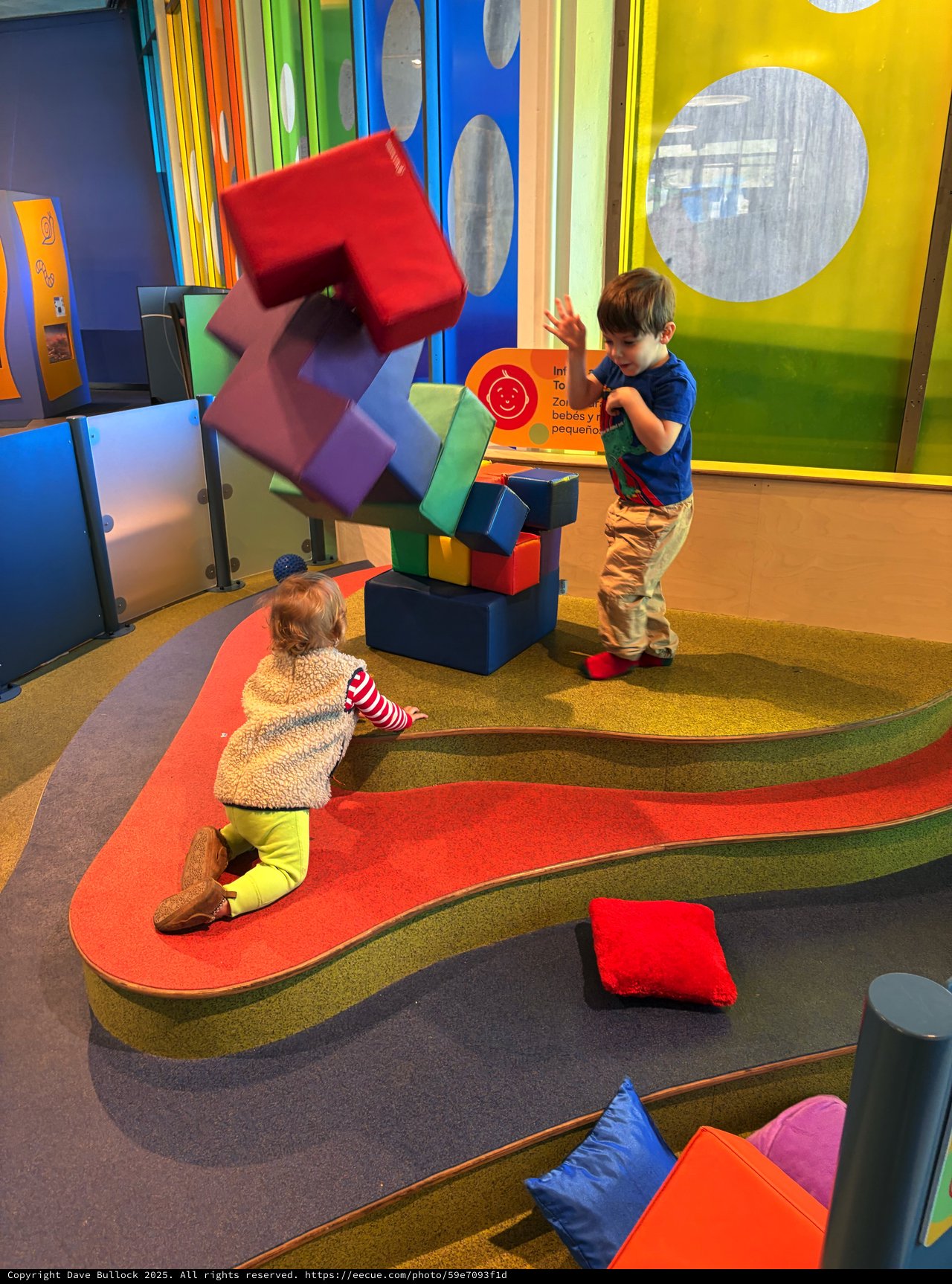 Children Playing with Colorful Building Blocks at Interactive Museum