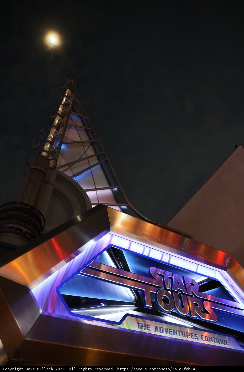 Illuminated Star Wars Land Sign at Night