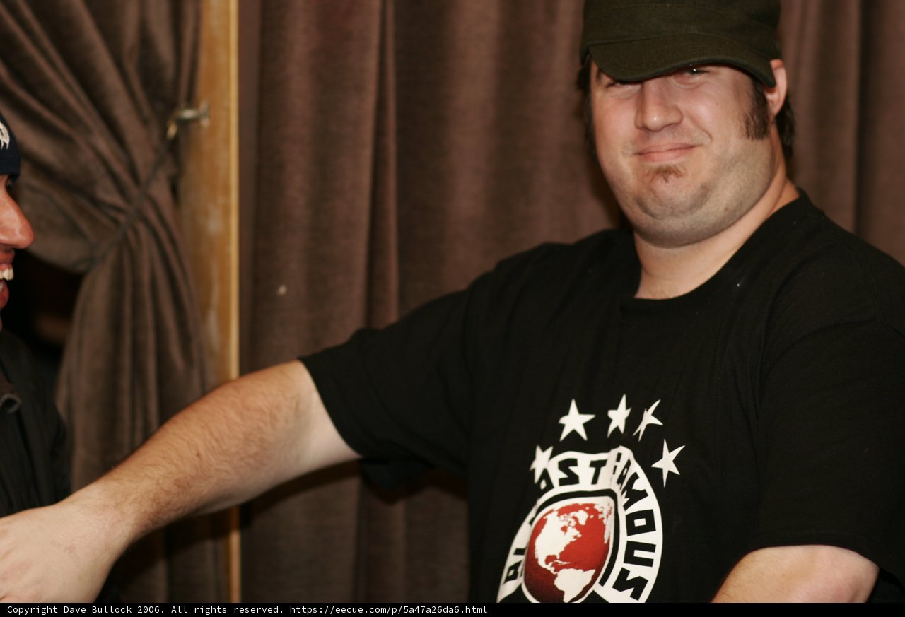 Man in Black Shirt and Baseball Cap