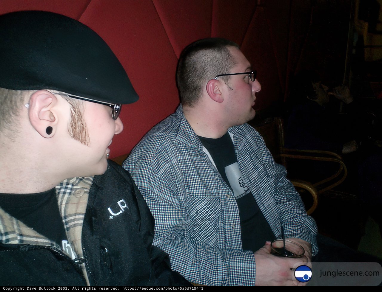 Two Men Enjoying Drinks at the Pub