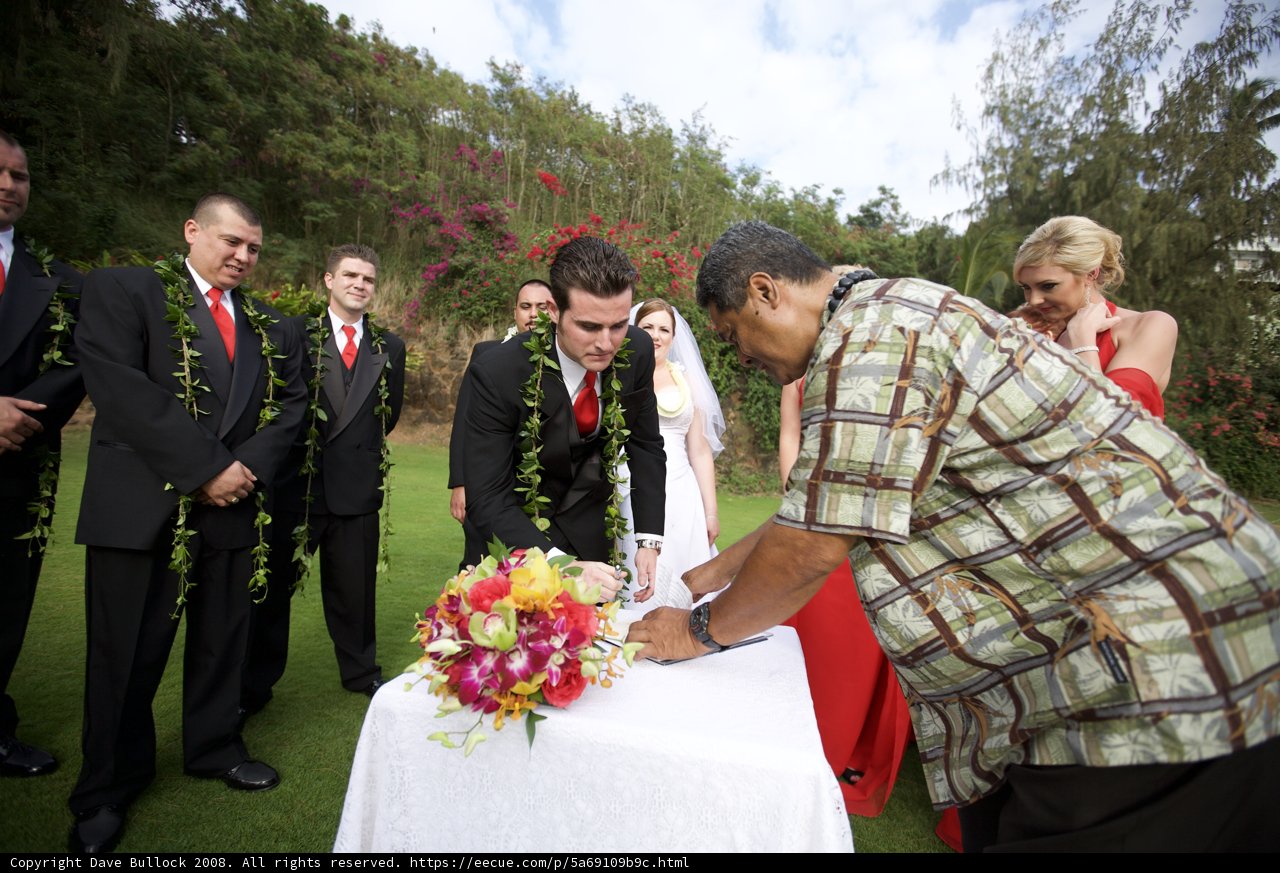 Wedding ceremony with the groom signing the certificate
