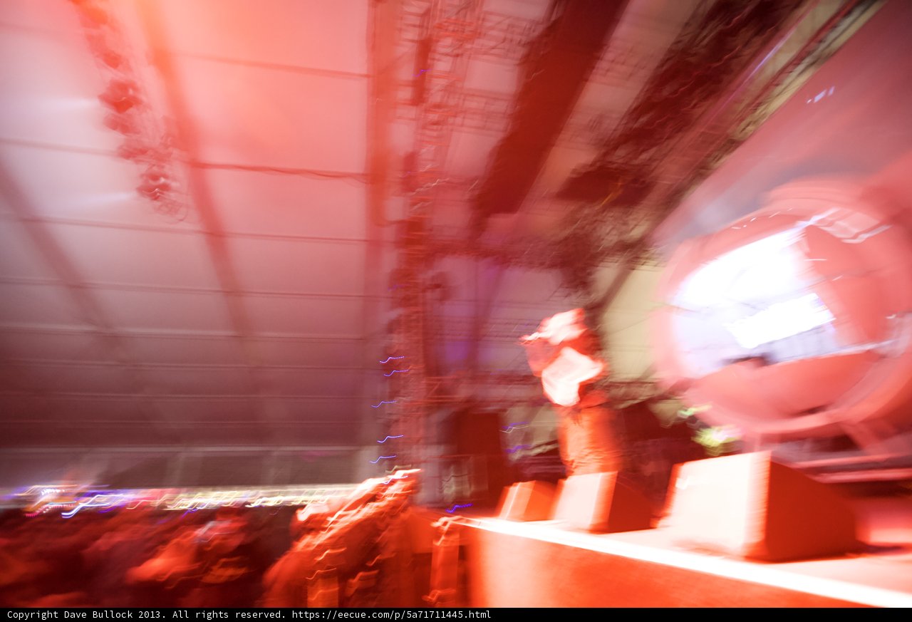 Man on Stage under Urban Lighting