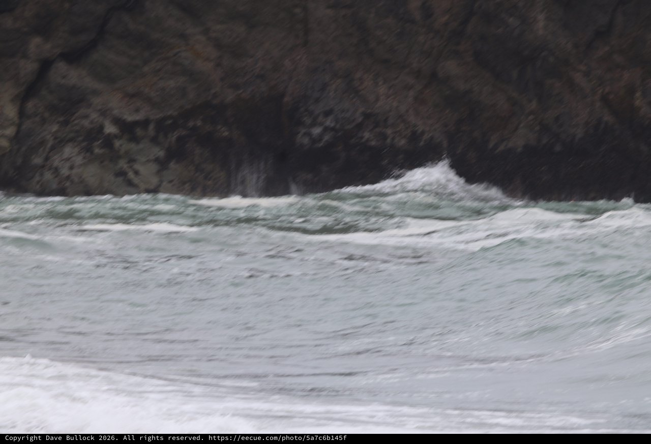 Wild Waves Crash Against Rugged Coastal Cliffs