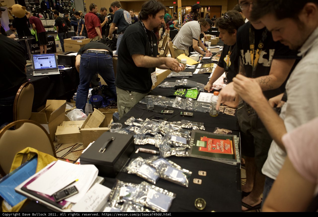 Tech Enthusiasts Gather around Electronics Table