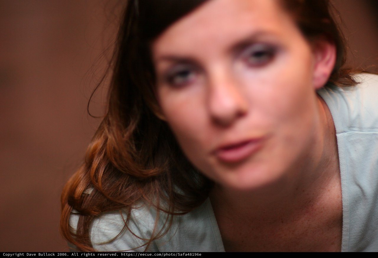 Pensive Young Woman in Soft Bokeh Portrait