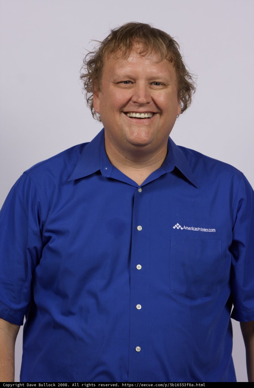Blue Shirted Man with a Smile