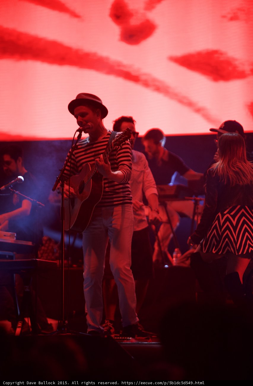 Belle and Sebastian Stuart Murdoch Acoustic Guitar Woman Chevron Dress Dancing Cap Red Stage
