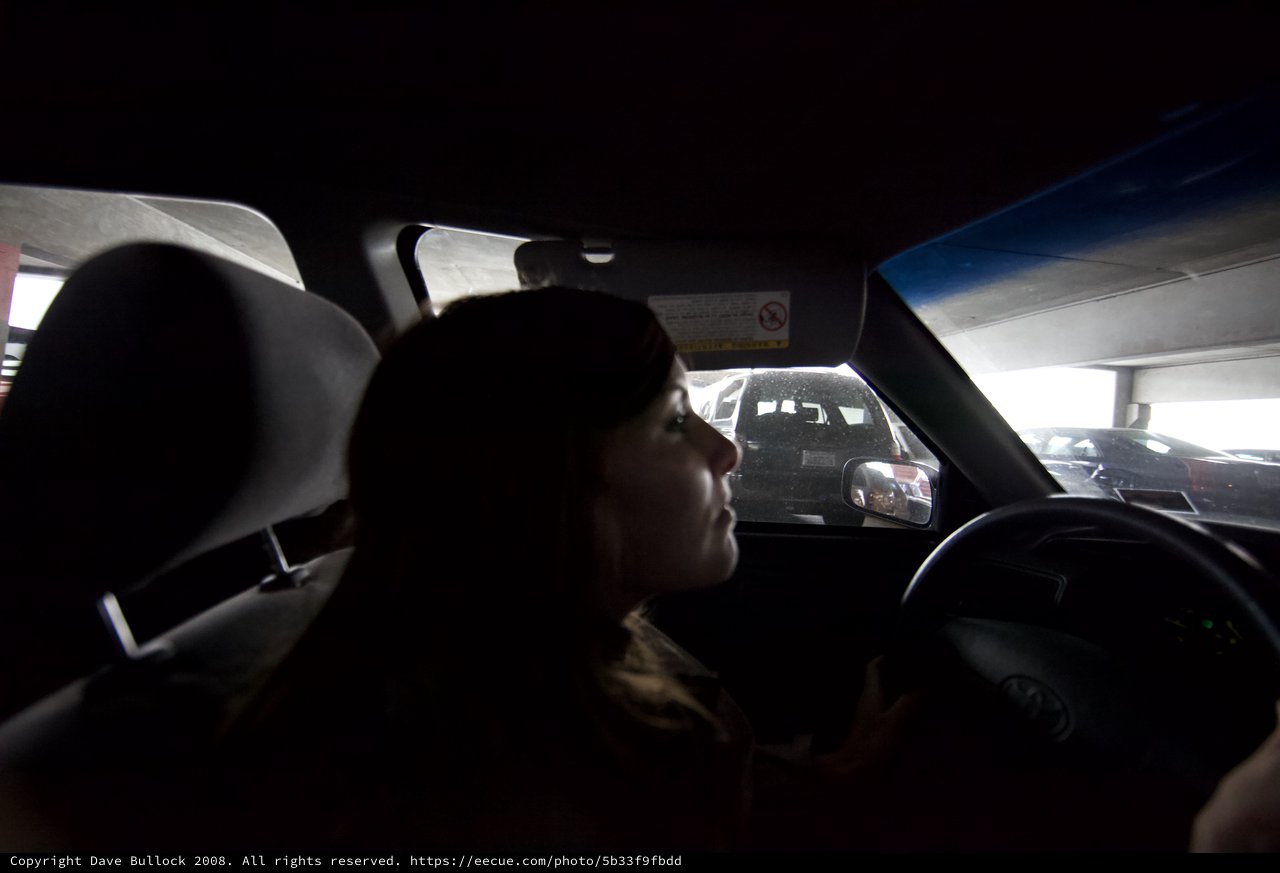Silhouetted Driver in Dark Parking Garage Interior