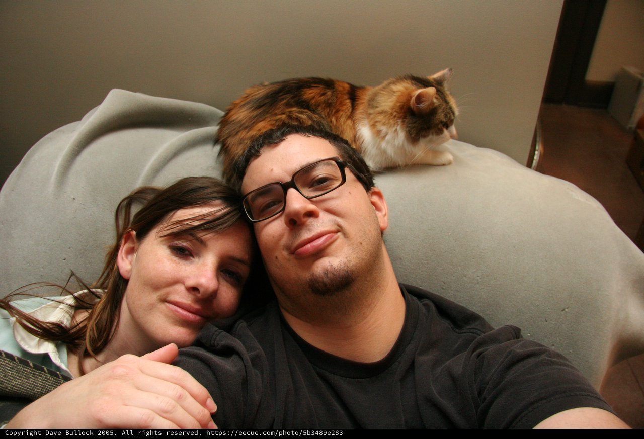 Cozy Couple Selfie with Calico Cat Companion