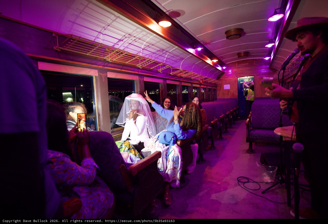 Bride Celebration on Vintage Purple-Lit Train Car