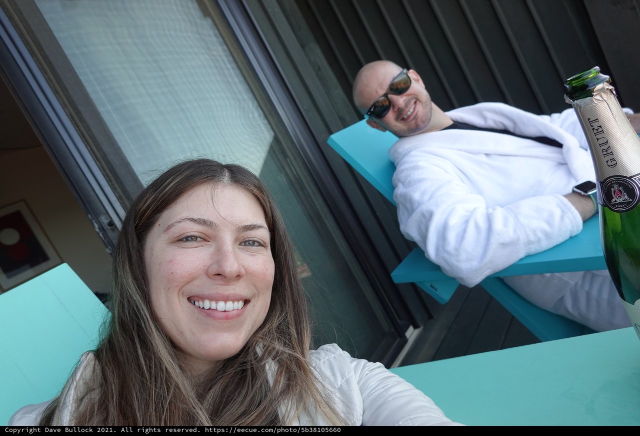 Couple Celebrating with Champagne by Pool