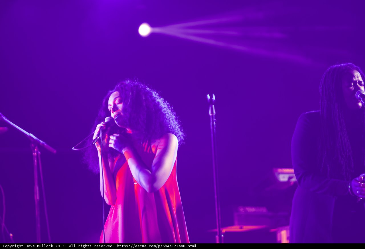 Solange Portrait Eyes Closed Hand On Chest Red Dress Backing Vocalist Purple