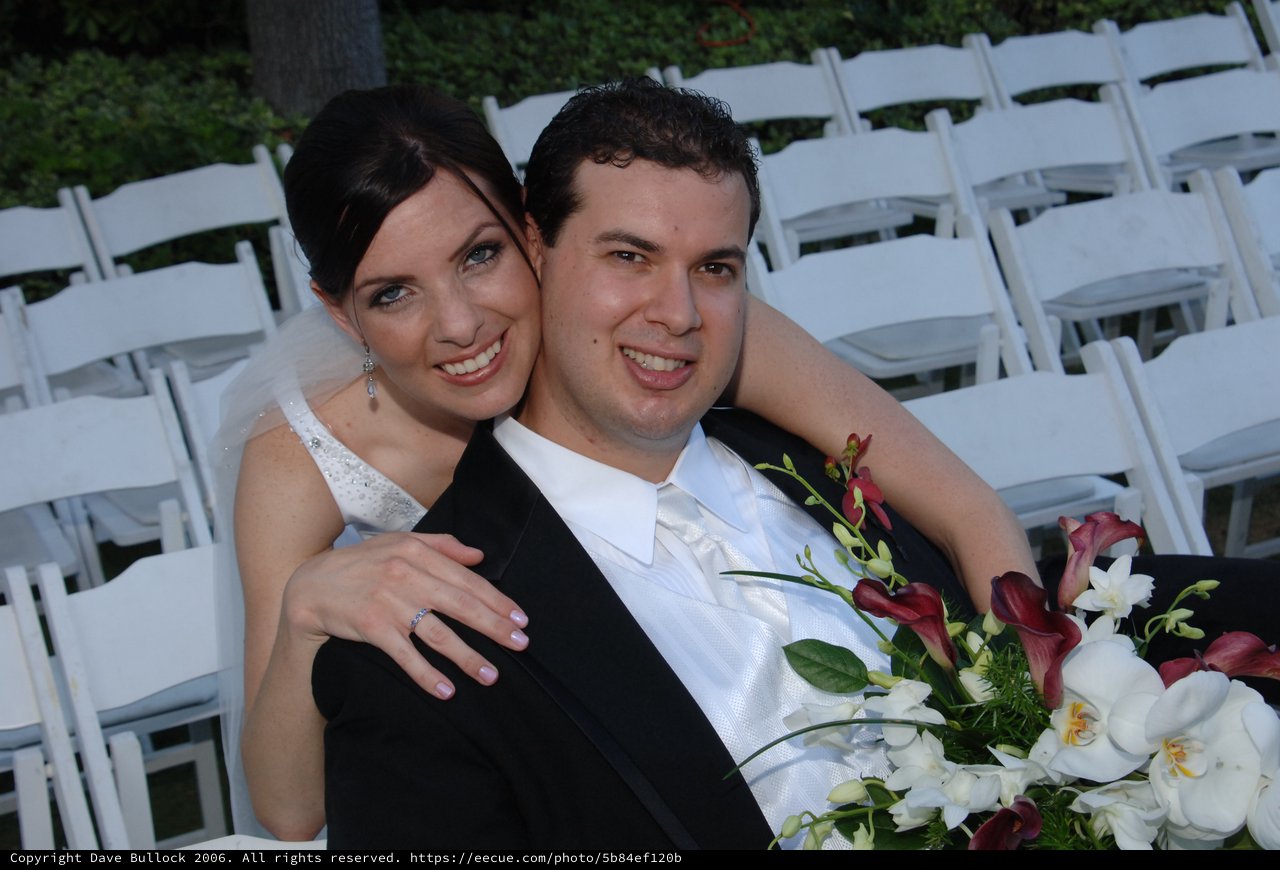 Bride and Groom Embrace at Outdoor Wedding Ceremony