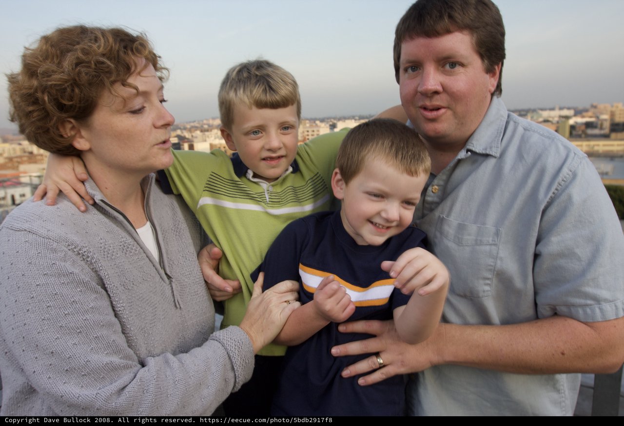 Family Portrait on Rooftop Terrace at Dusk