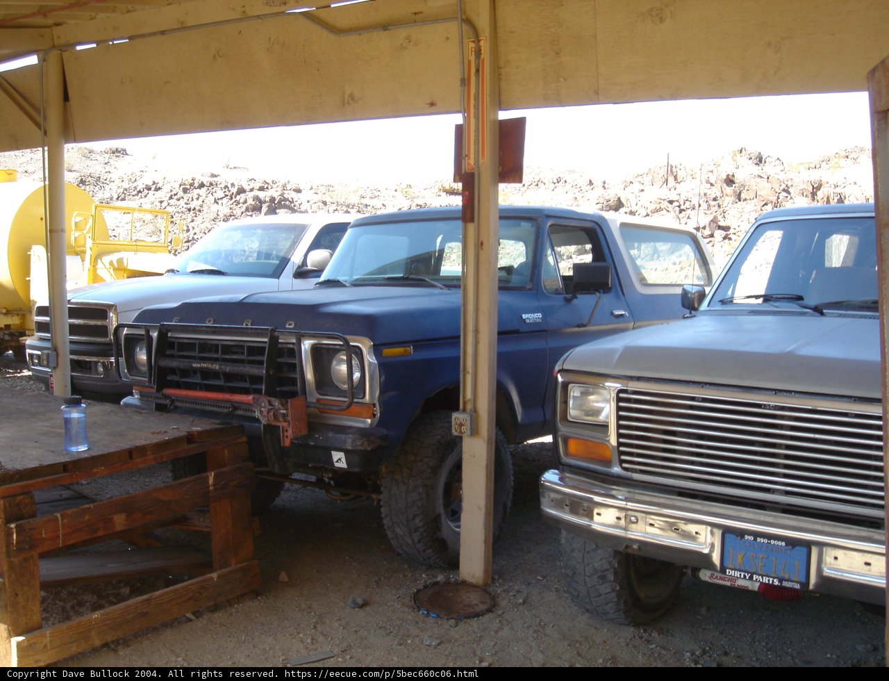 Blue Pickup Truck Under Wooden Structure