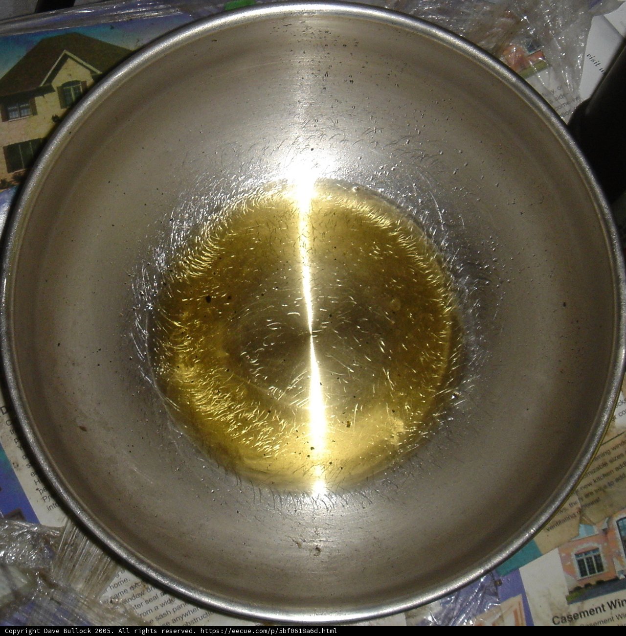 Golden Oil in Sleek Metal Bowl