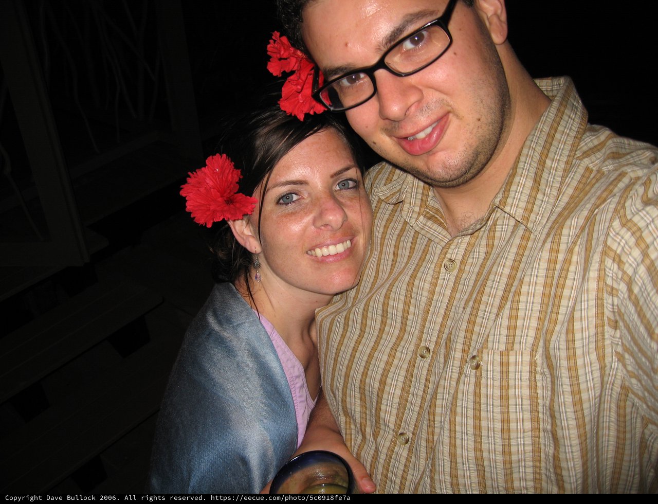 Couple Smiling Together at a Tropical Evening Event