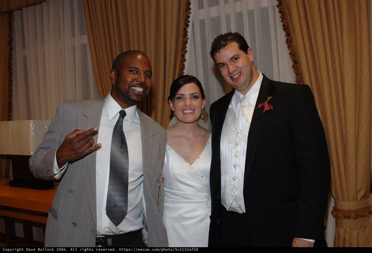 Joyful Wedding Celebration with Bride, Groom, and Guest
