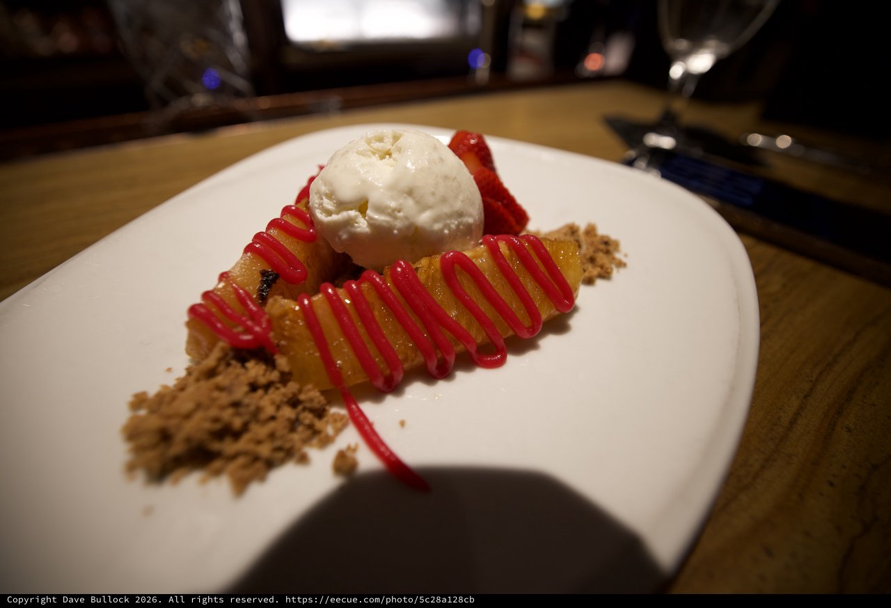 Gourmet Dessert Plate with Vanilla Ice Cream and Berry Drizzle