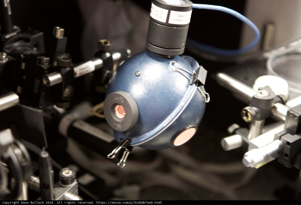 Blue and White Can Attached to Machine
