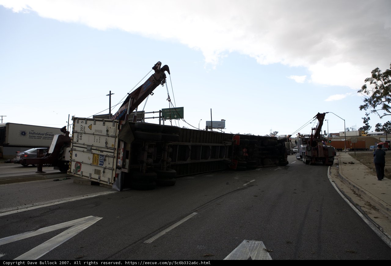 Rescue Mission: Crane Lifts Overturned Truck Off Roadway