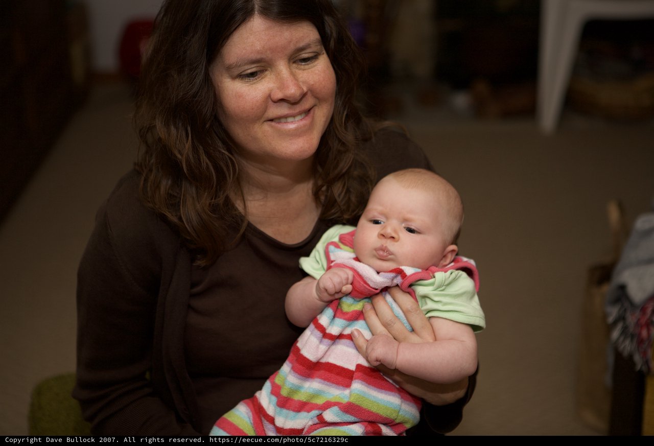 Mother's Joy: Tender Moment with Newborn Baby
