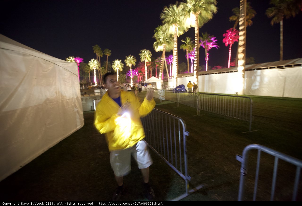 Yellow Jacketed Man Enjoys the Polo Club at Night