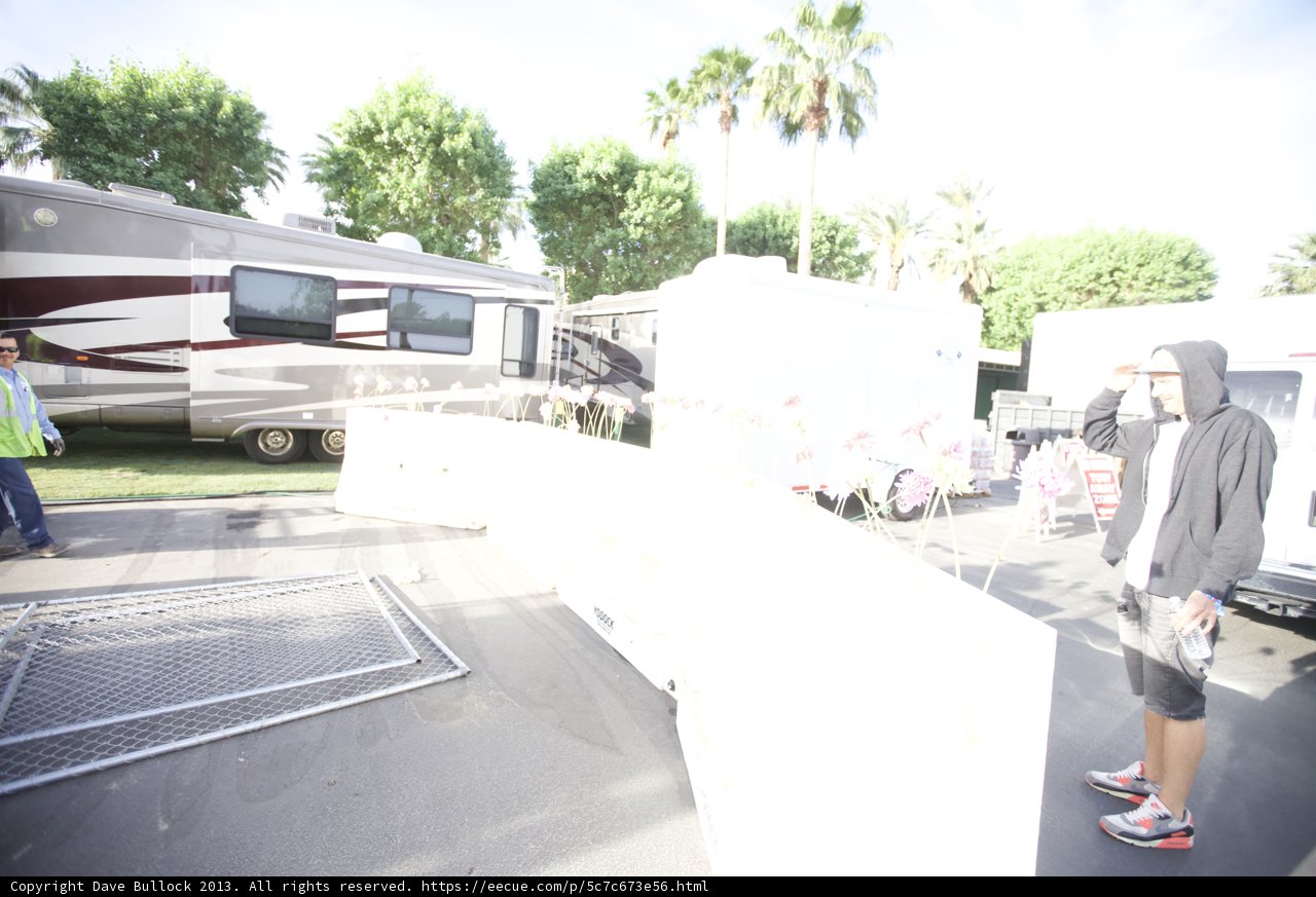 Man and Trailer with White Fence in Coachella
