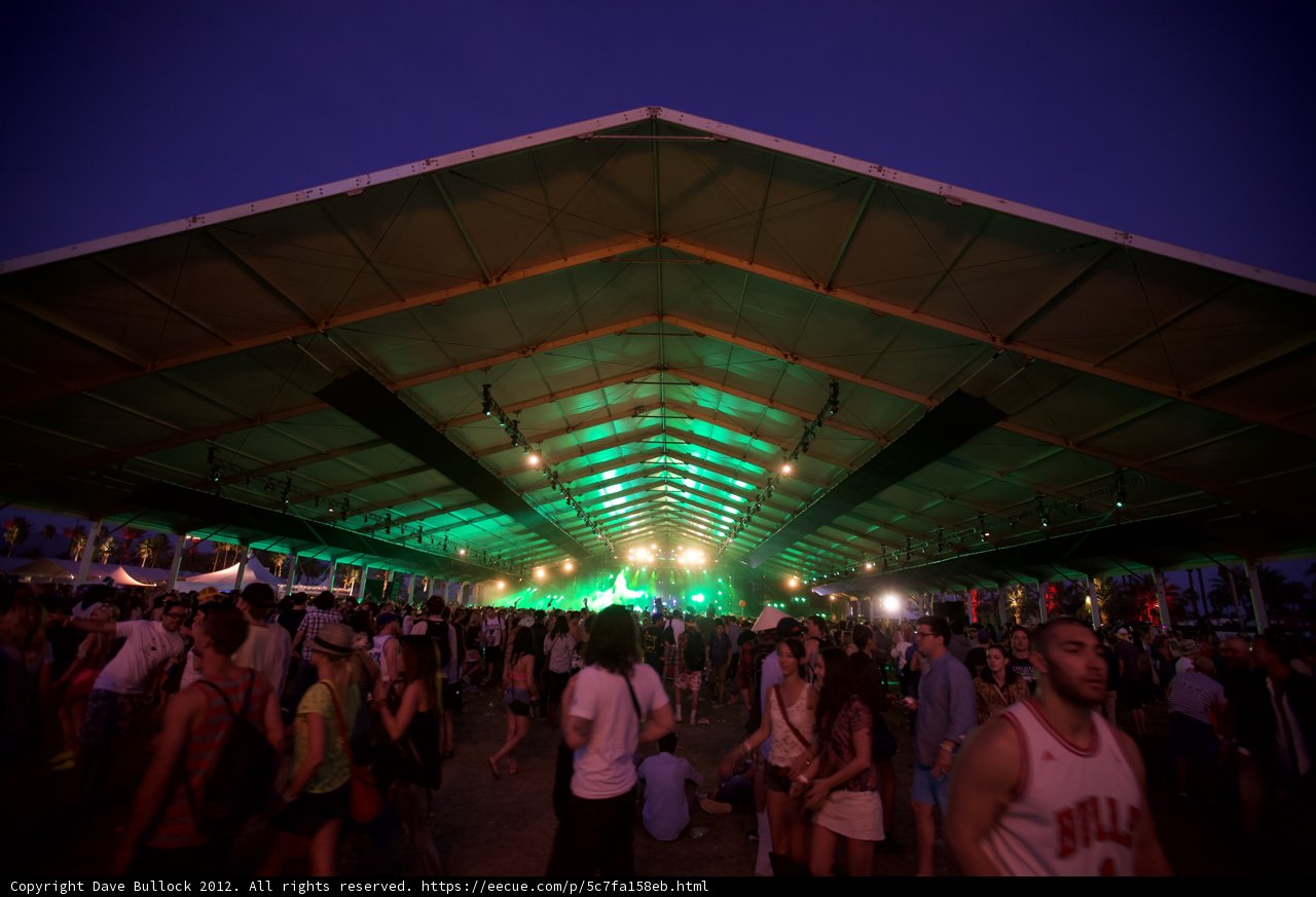 Nighttime Concert Crowd Under Urban Tent
