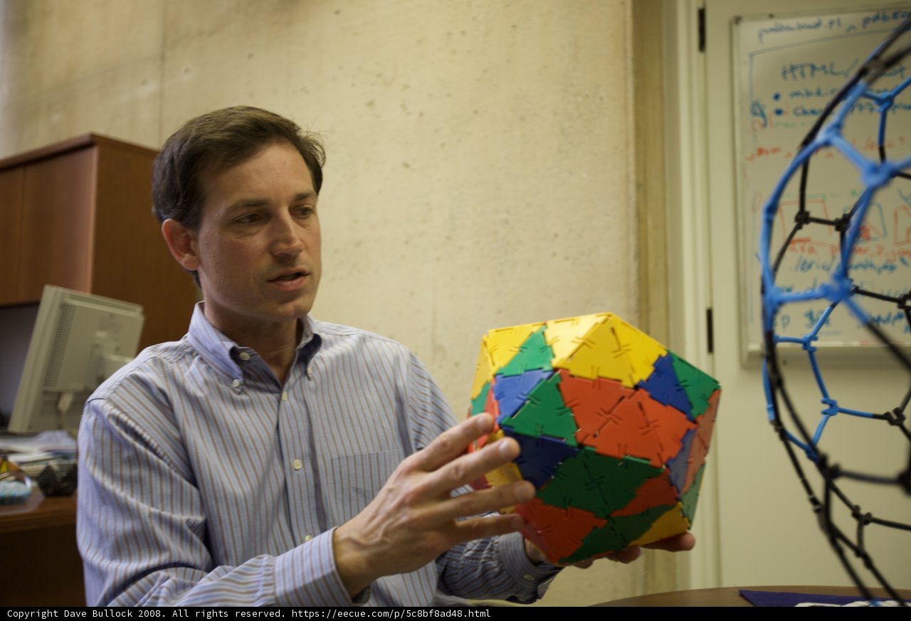 Colorful Sphere in the Hands of a Man