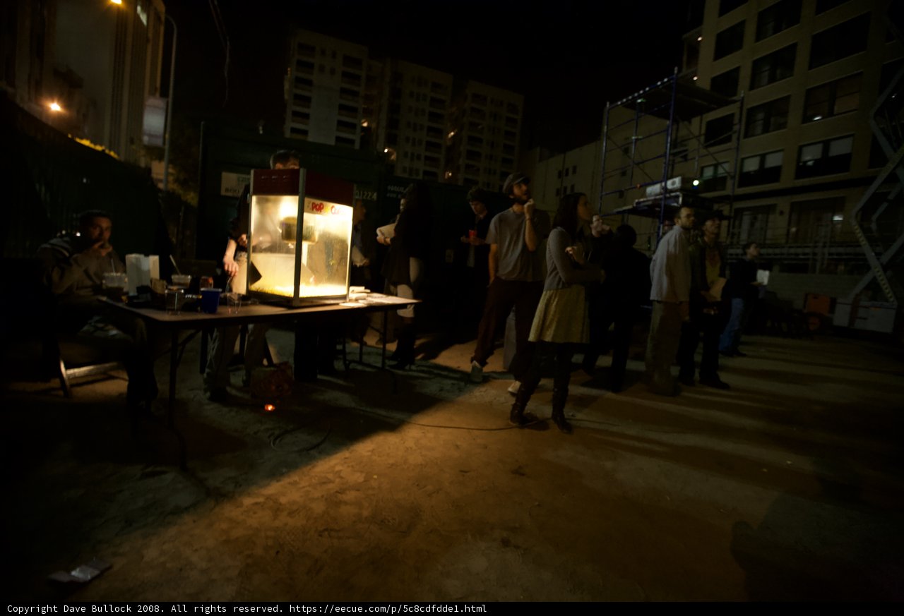 Nighttime Gathering Around Wooden Table