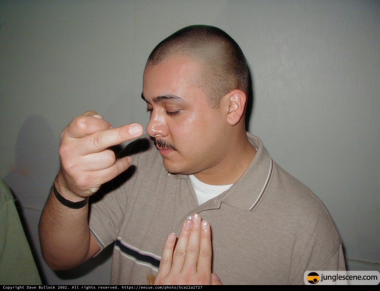 Mustached Man Enjoying a Cigarette