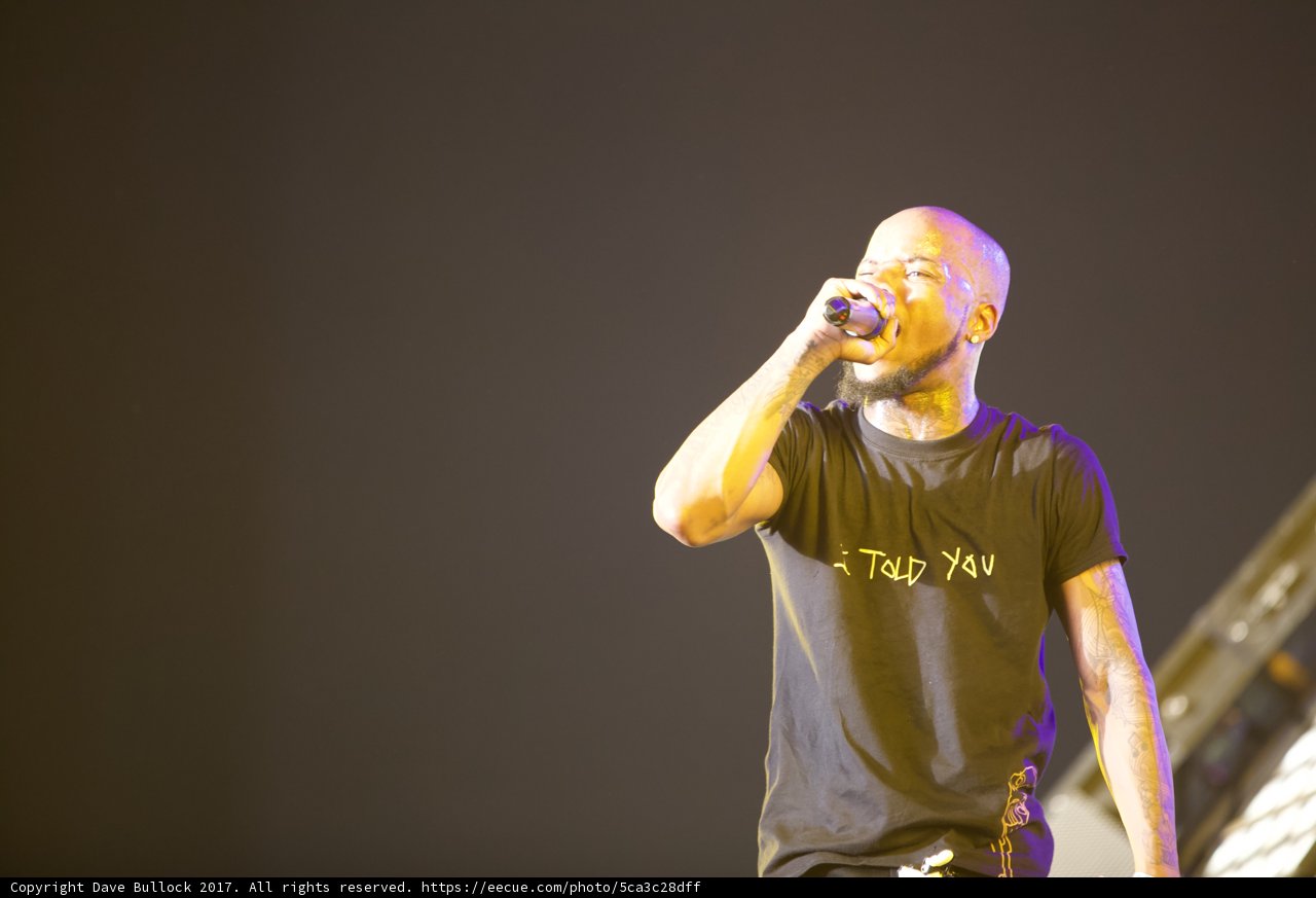 Black-Shirted Performer Sings His Heart Out