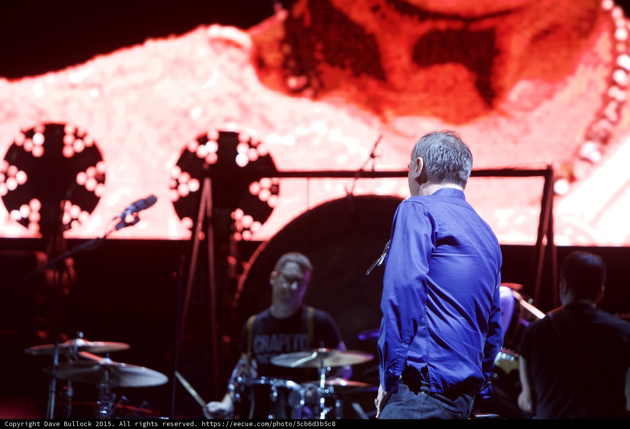 Morrissey From Behind Blue Shirt Drummer Glasses Capitol Records Tee Three Circular Lights Red Screen