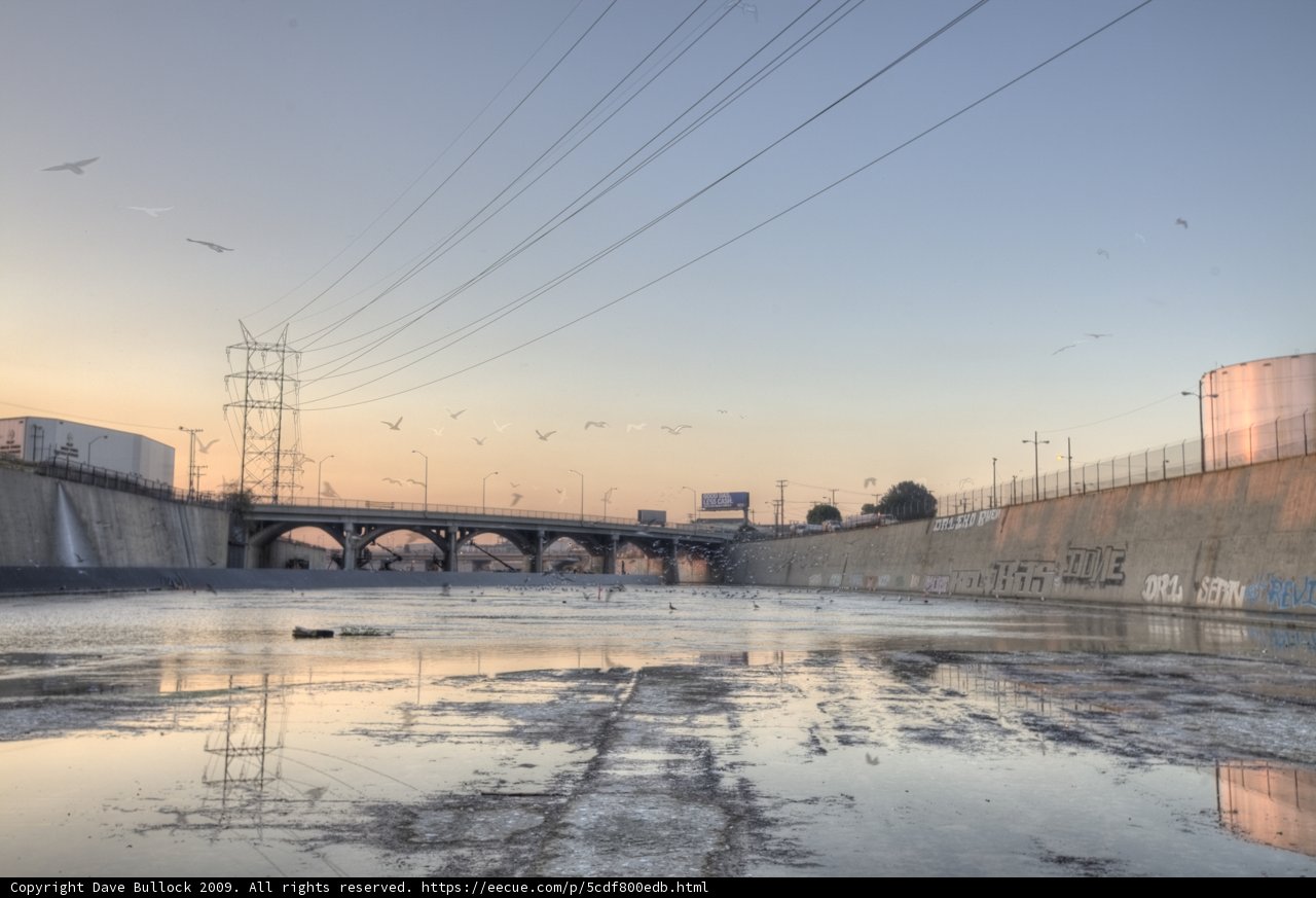 Serene Waters with Industrial Power Lines
