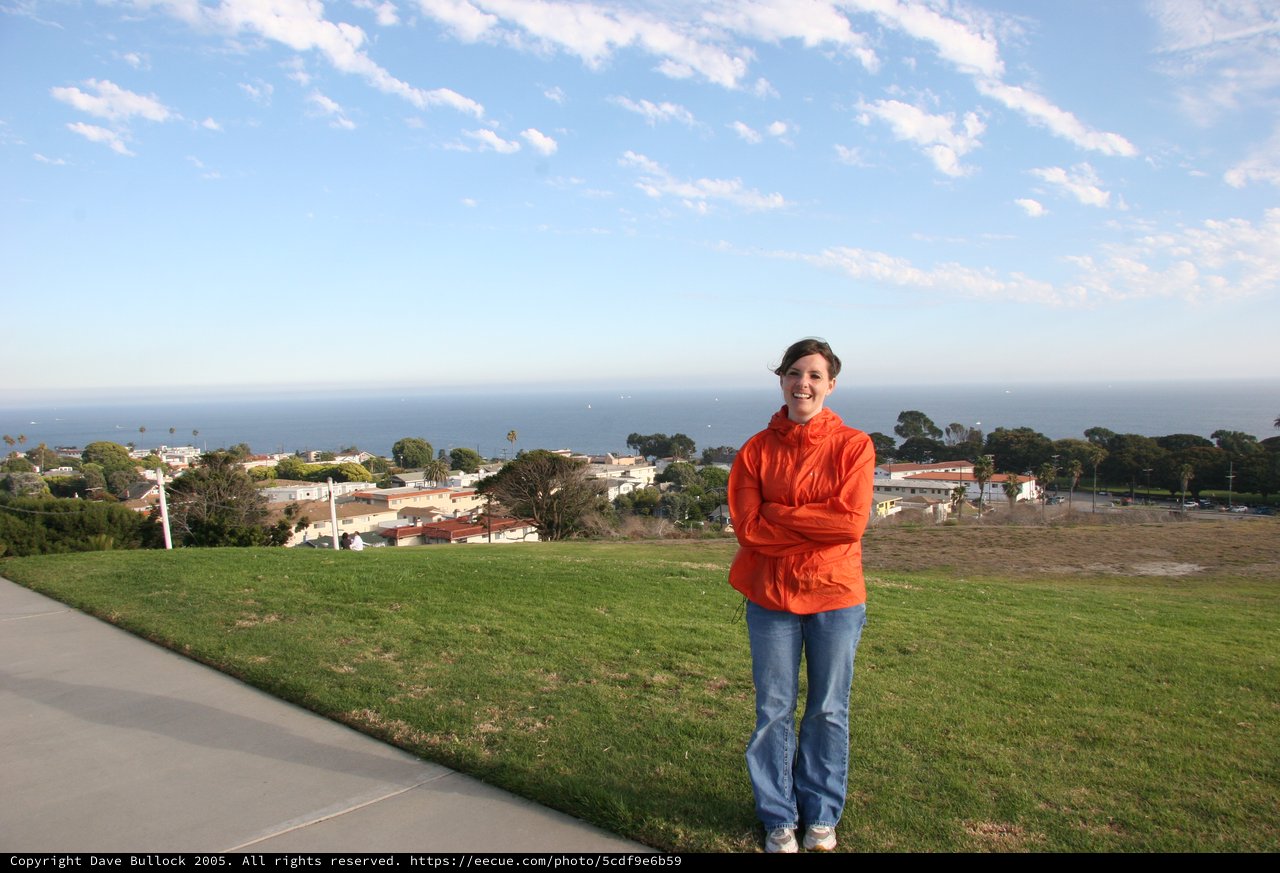 Smiling Woman Overlooking Coastal California Town