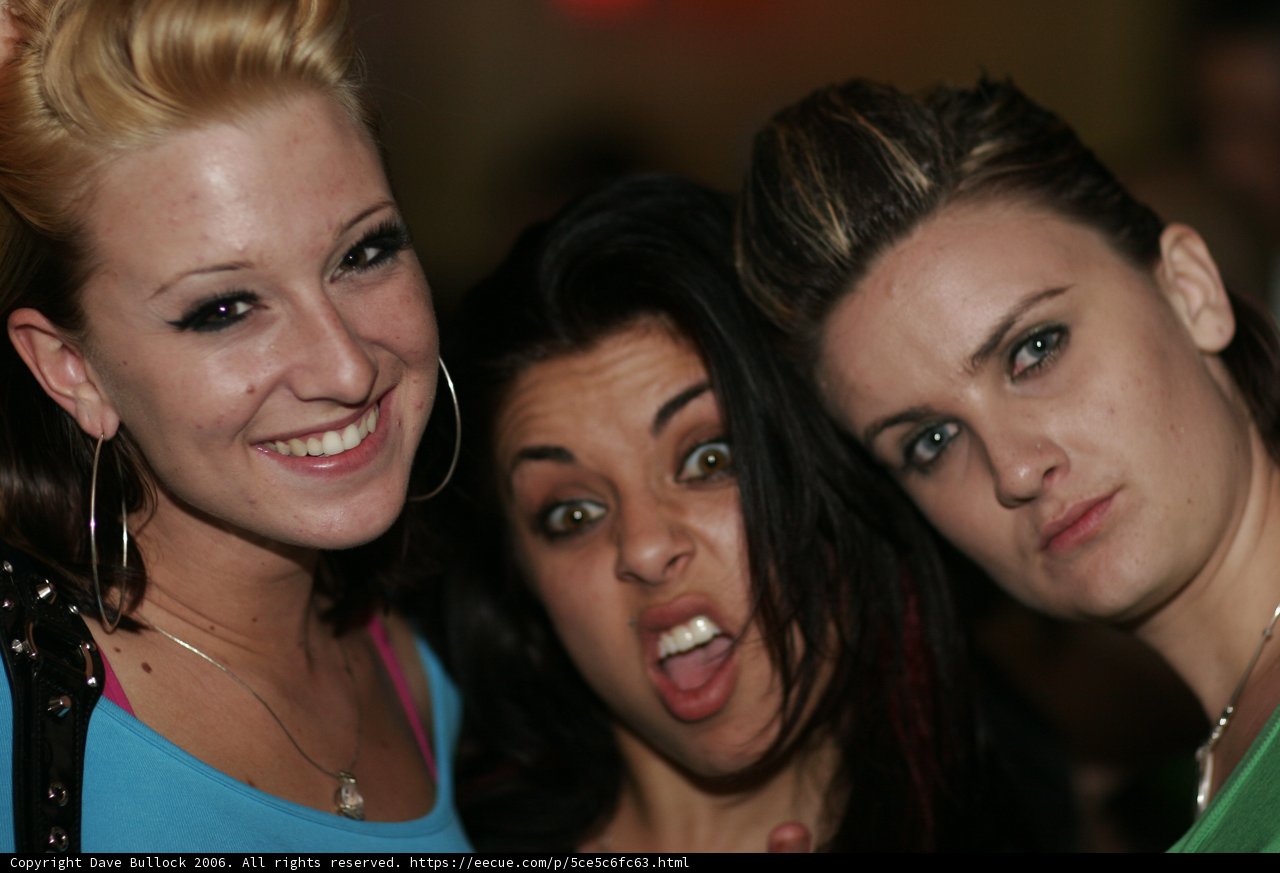 Three Women Decked Out in Accessories Strike a Pose at Night Club