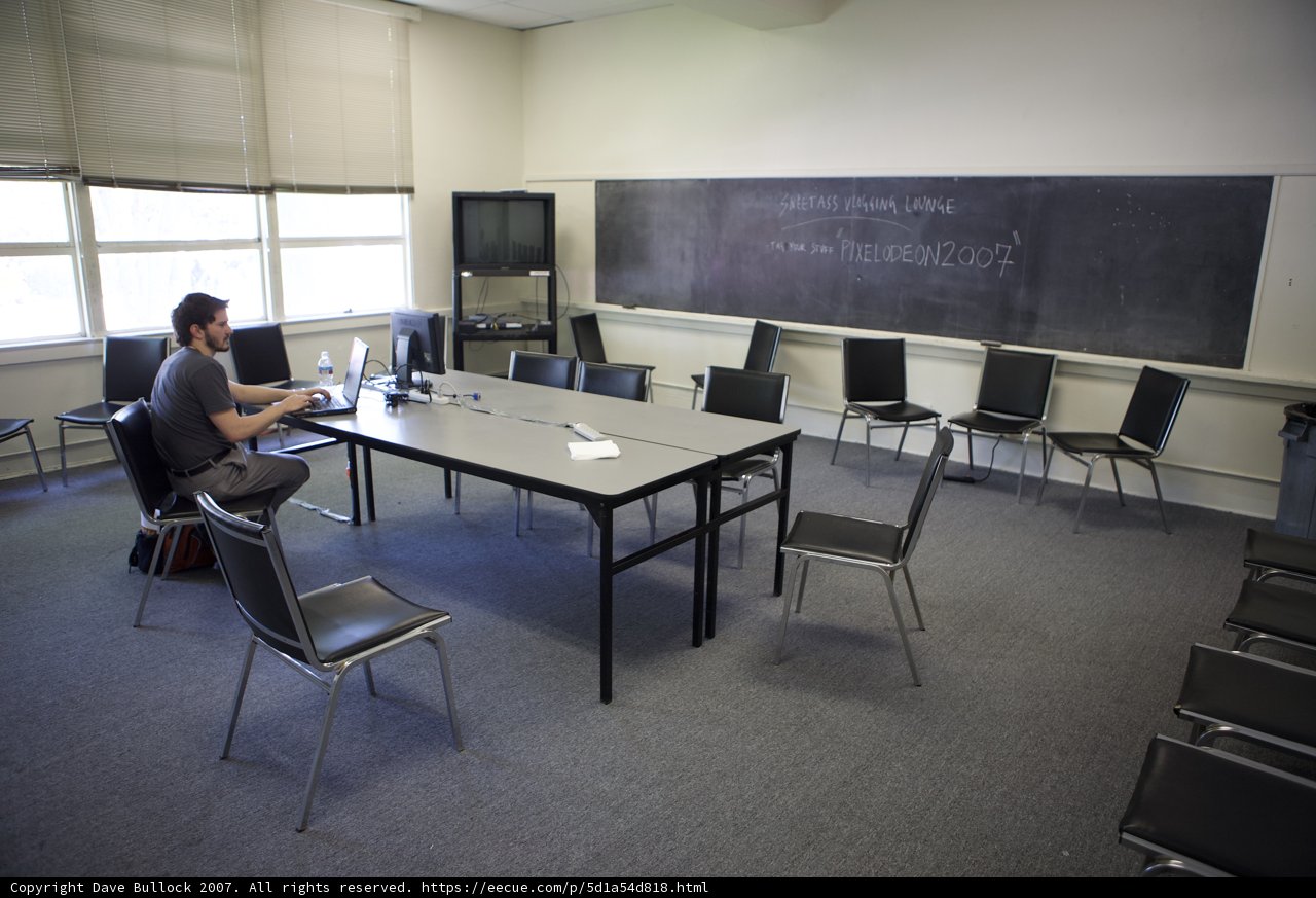 Studious Man at Chalkboard Table