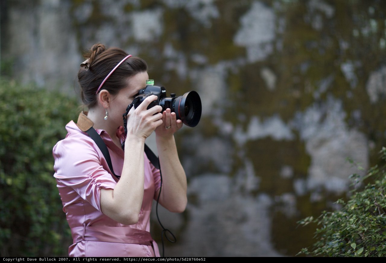 Photographer in Pink Capturing Moments at Mission