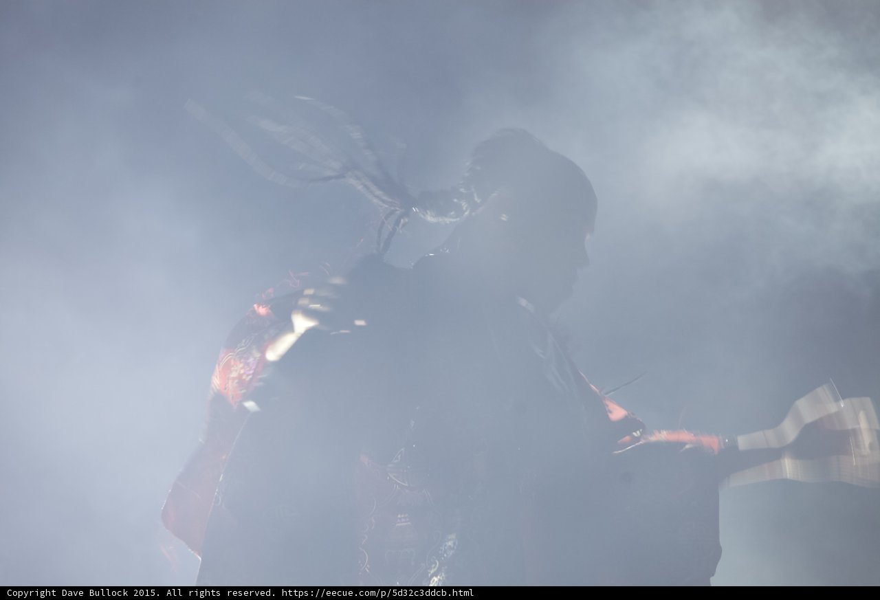 FKA twigs Dynamic Silhouette Two Braids Flying Red Brocade Kimono Guitarist Band Heavy Haze Motion
