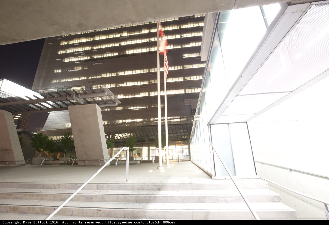 Flag flying high on an office building