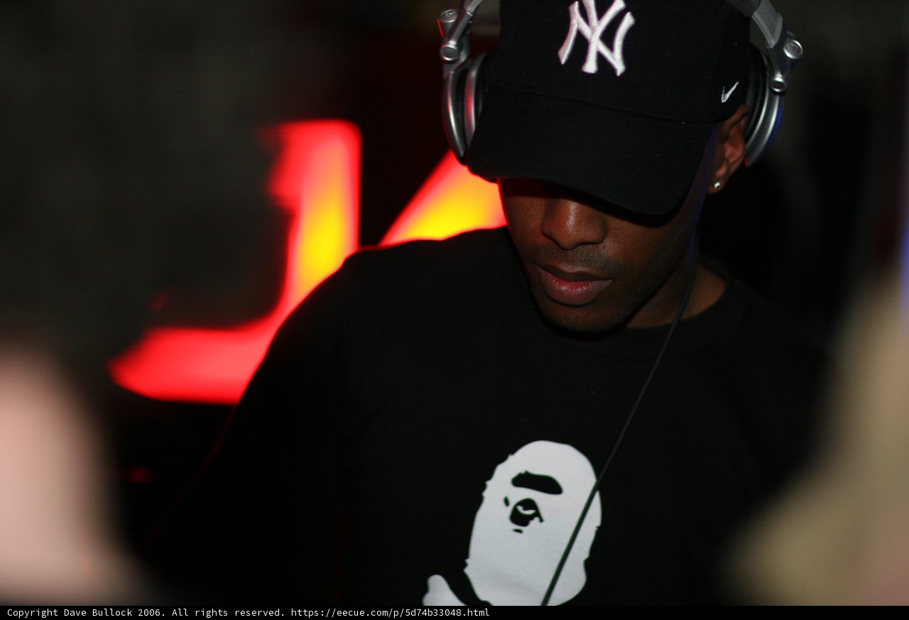 Black Shirted Man with Baseball Cap