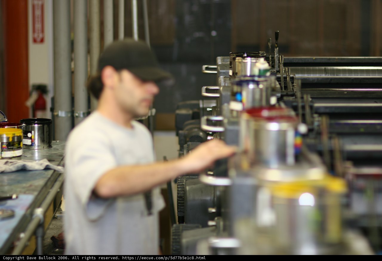 Factory Worker Operating Machinery