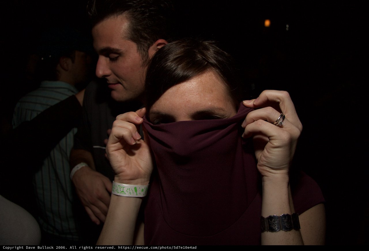 Playful Face Hide at Late Night Club Event