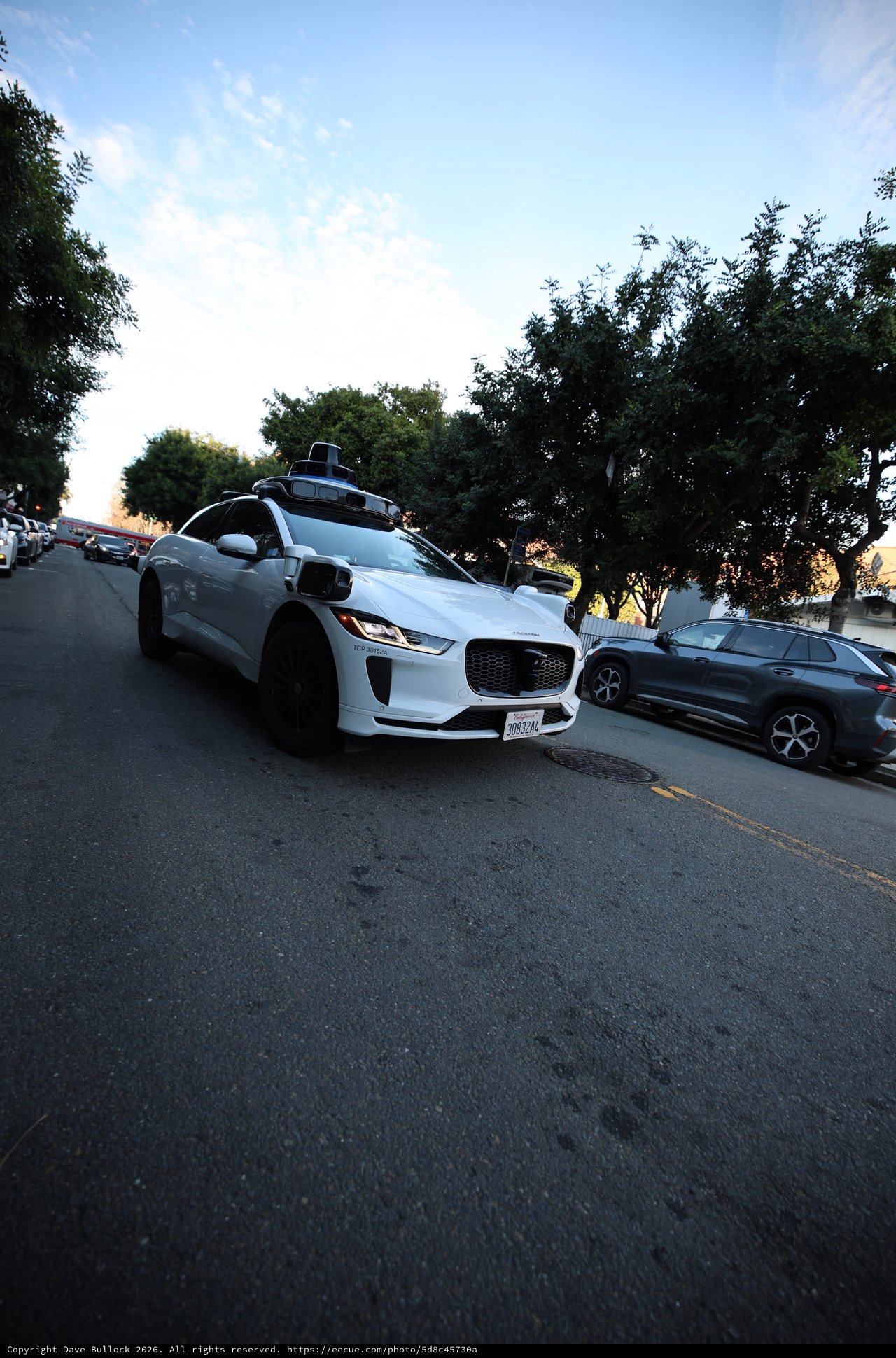 Autonomous Jaguar I-PACE Self-Driving Vehicle on Residential Street