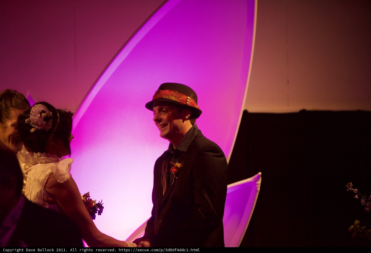 The Wickstrom Wedding Couple Poses with a Purple Glow