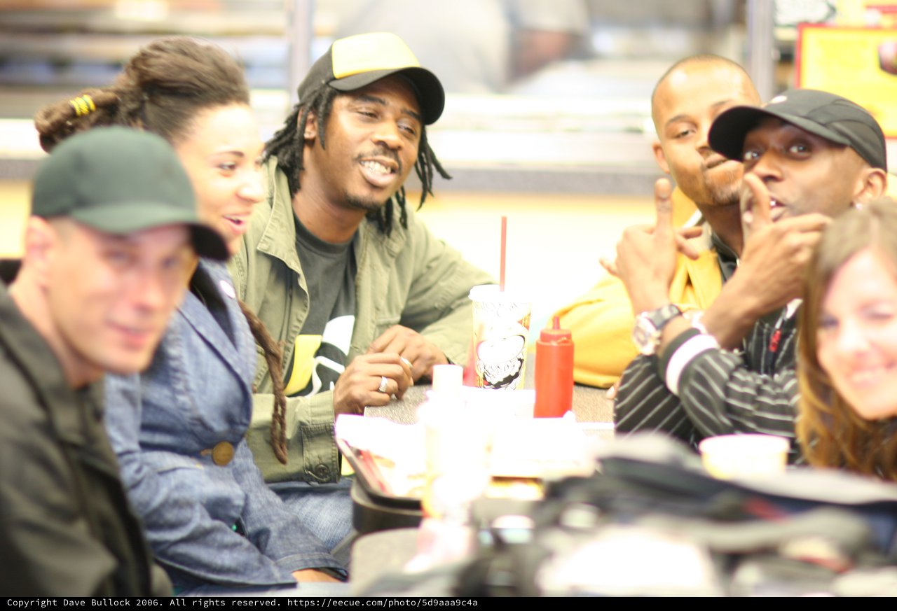 Friends Laughing Together at Fast Food Restaurant