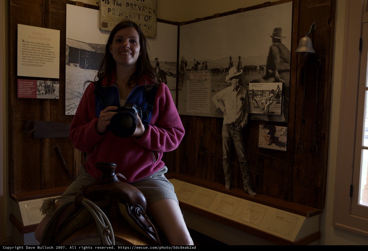 Young Woman Sits on Saddle in Western Ranch Museum